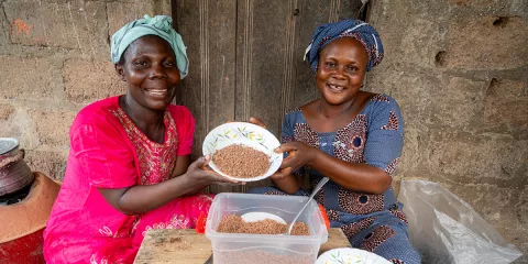 Emefa and Adjo serve sorghum couscous which has been steamed and ready to eat.