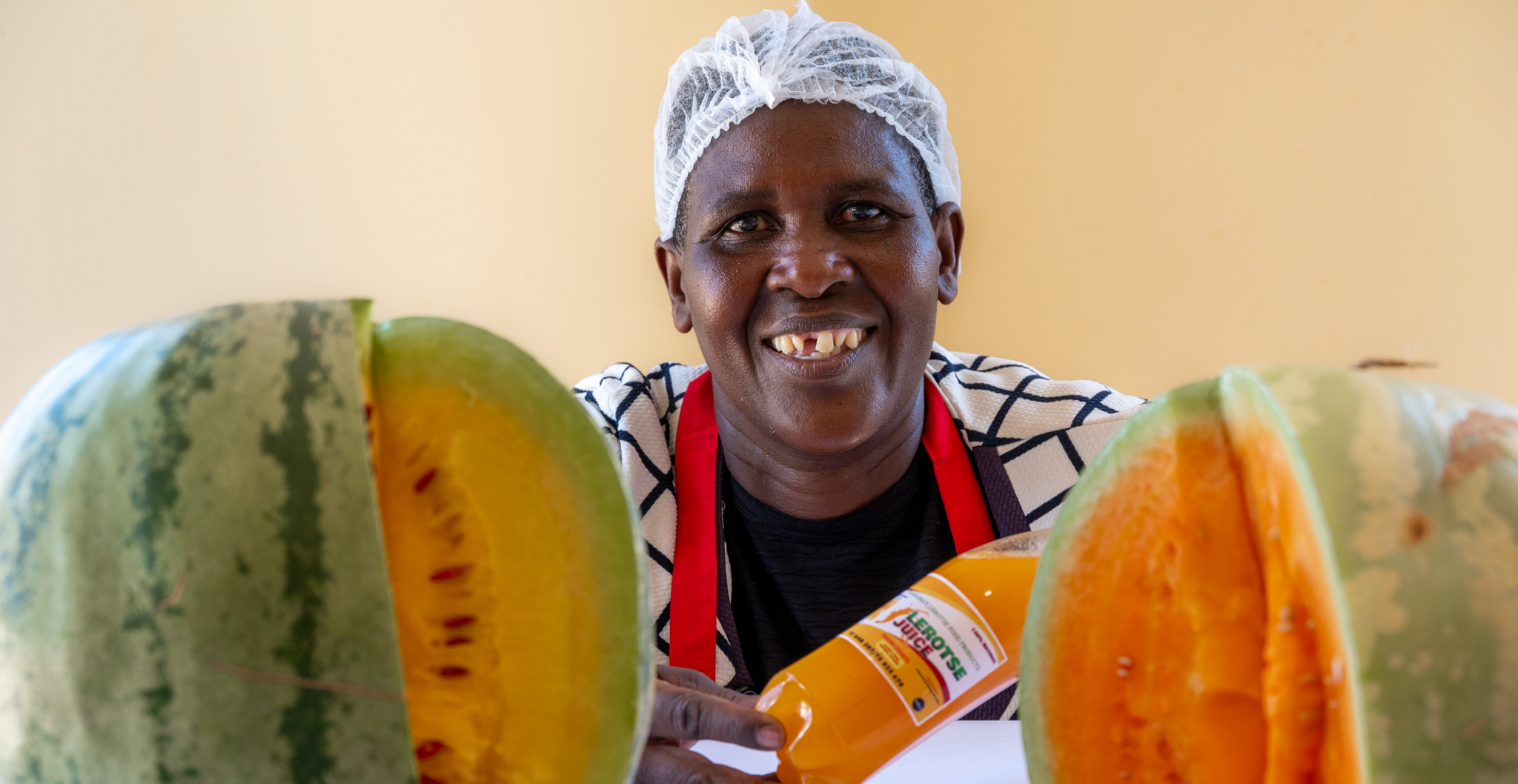 Masego Ramolaise, a farmer in a village near Lentsweletau in southern Botswana, showing off her letrose juice.