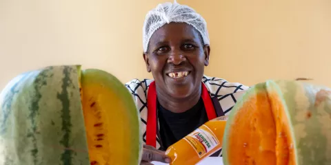 Masego Ramolaise, a farmer in a village near Lentsweletau in southern Botswana, showing off her letrose juice.