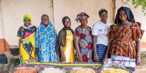 Members of the Jahaur Yanpi Cooperative show the groundnuts, millets, cowpea and maize they will use to make a legume-cereal based complementary porridge.